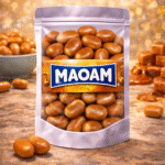Maoam Pinballs cola snoep, ronde colasmaak kauwsnoepjes met een knapperige suikerlaag, bruine cola dragees van Maoam, tintelend zacht snoepgoed
